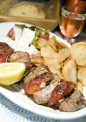 Image showing pork souvlaki with tzatiki house wine bread 