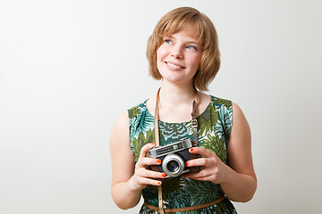 Image showing Woman with a vintage camera