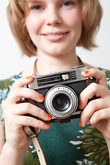 Image showing Woman with a vintage camera