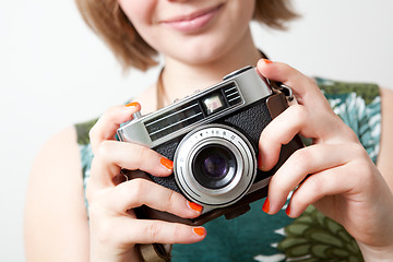 Image showing Woman with a vintage camera