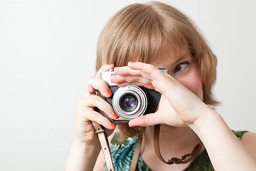 Image showing Woman with a vintage camera