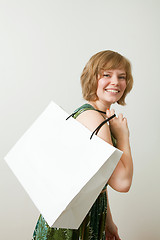 Image showing Young woman with shopping bag