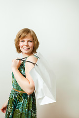 Image showing Young woman with shopping bag