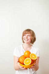 Image showing Woman with oranges