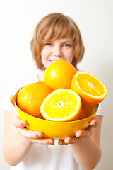 Image showing Woman with oranges