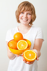 Image showing Woman with oranges