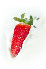 Image showing strawberry splashing into milk