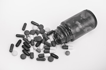 Image showing pills in glass container