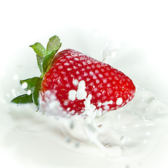 Image showing strawberry splashing into milk