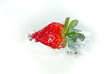 Image showing strawberry splashing into milk