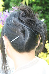 Image showing Black hair with  hair-slide