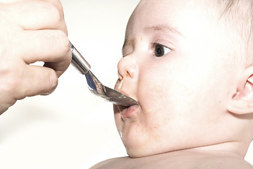 Image showing baby eating