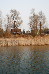 Image showing View on the river and village at dull day