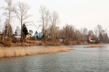 Image showing View on the river and village at dull day