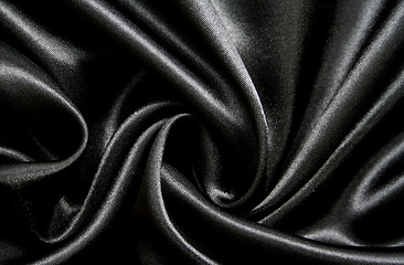 Image showing Smooth elegant black silk as background