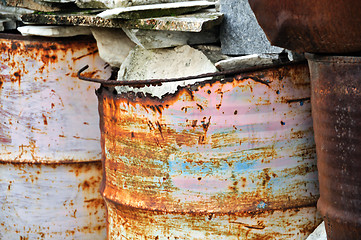 Image showing rusty metal barrels