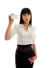 Image showing Beautiful business woman holding a credit club or business card