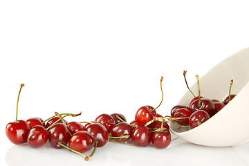 Image showing Sweet red cherries and ceramic bowl