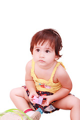 Image showing baby plays with toy over white background 