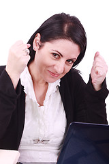 Image showing Business woman happy in front of her laptop at the office