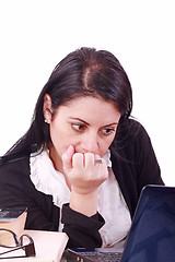 Image showing Office worker with thoughtful look in front of laptop computer