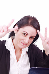 Image showing A pretty arabic american business woman signaling success at office 