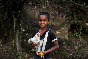 Image showing Boy with  chicken