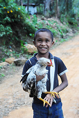 Image showing Boy with  chicken