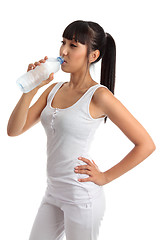 Image showing Fit healthy girl drinking water