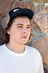 Image showing Young Man Smoking a Cigarette