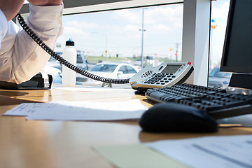 Image showing Man Working At His Desk