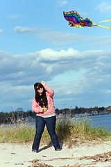 Image showing Girl Flies a Kite at the Sea Shore