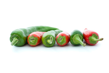 Image showing Some red and green hot peppers - side view