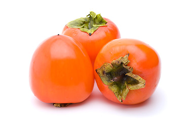 Image showing Three persimmons
