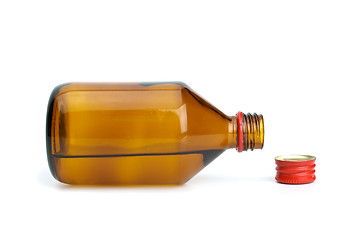 Image showing Bottle with liquid and cap near