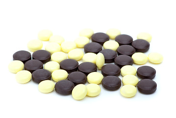 Image showing Some yellow and brown tablets