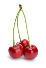 Image showing Three ripe red cherries