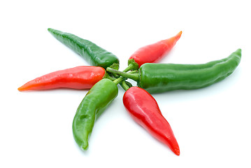 Image showing Some red and green hot peppers in form of flower