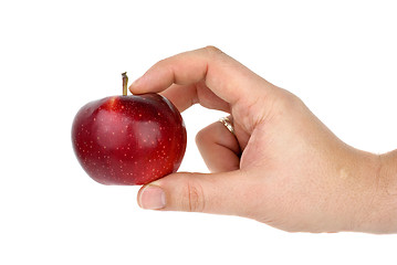 Image showing Hand taking red apple