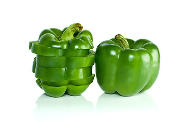 Image showing Whole green sweet pepper and few slices