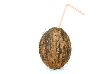 Image showing Single coconut with straw