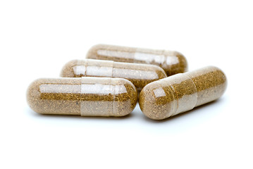 Image showing Four homeopathyc brown pills