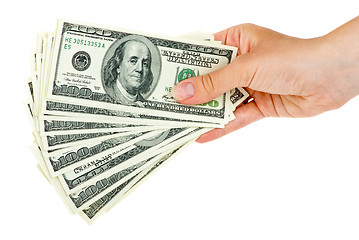 Image showing Hand holds bunch of $100 bills