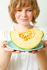 Image showing Woman with cantaloupe melon