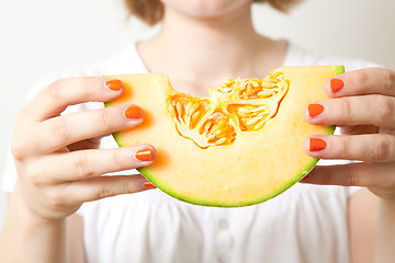 Image showing Woman with cantaloupe melon