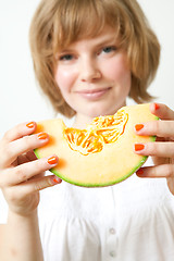 Image showing Woman with cantaloupe melon