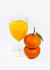 Image showing orange juice and two mandarin fruits