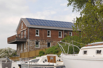 Image showing Old house with solar cells.