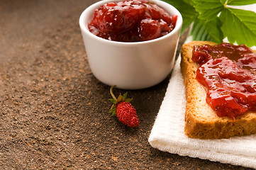 Image showing Wild strawberry jam with toast