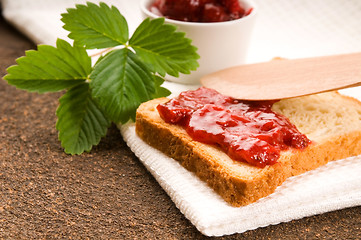 Image showing Wild strawberry jam with toast